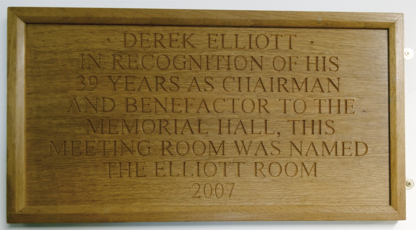 Plaque recognising Derek Elliott’s 39 years as chairman and benefactor to the Memorial Hall; the meeting room was named the Elliott Room in 2007