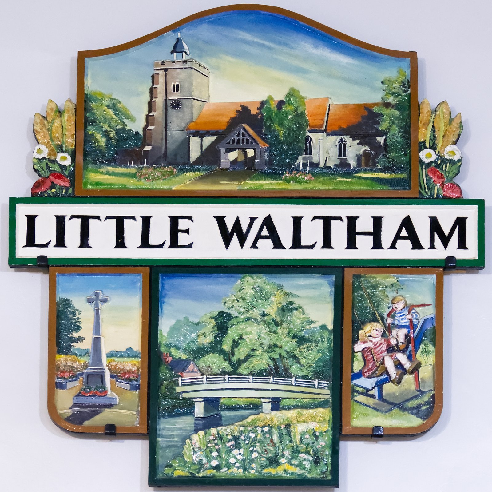 The Little Waltham village sign, showing the church, memorial cross and bridge